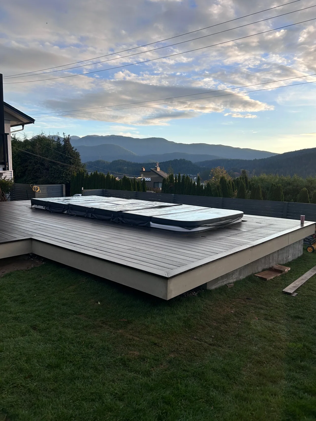Deep Cove deck with spa, final teak boards going down