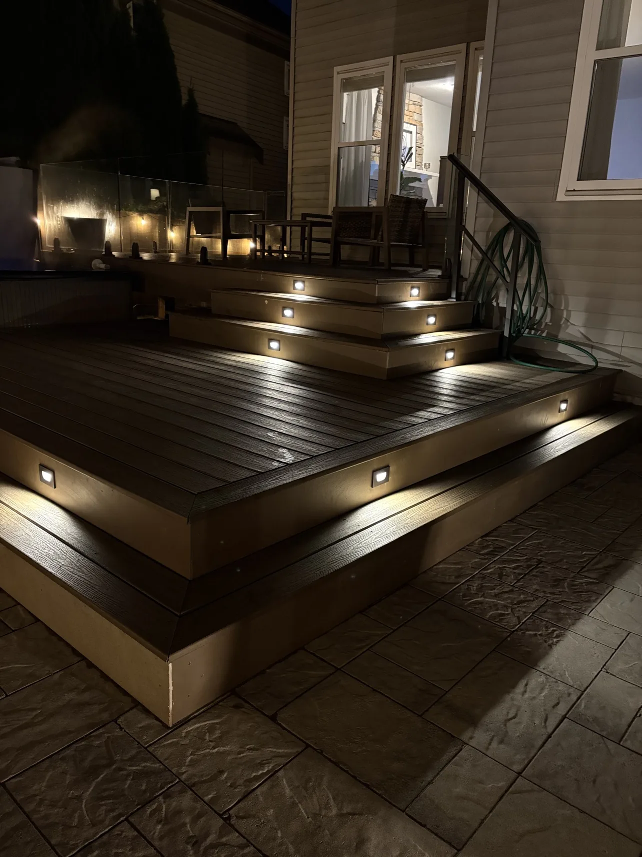 Deck finished at night, lit steps