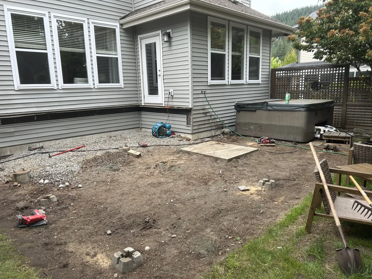 Deck build before: bare dirt yard