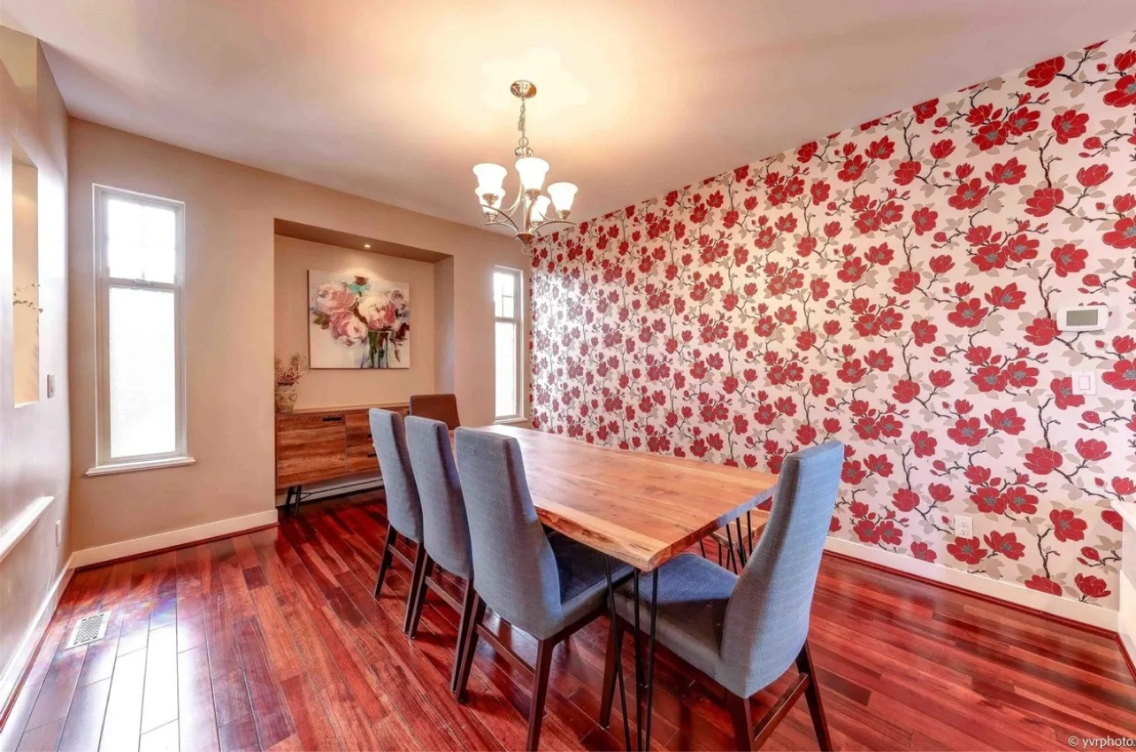 Dining room before: red floral wallpaper