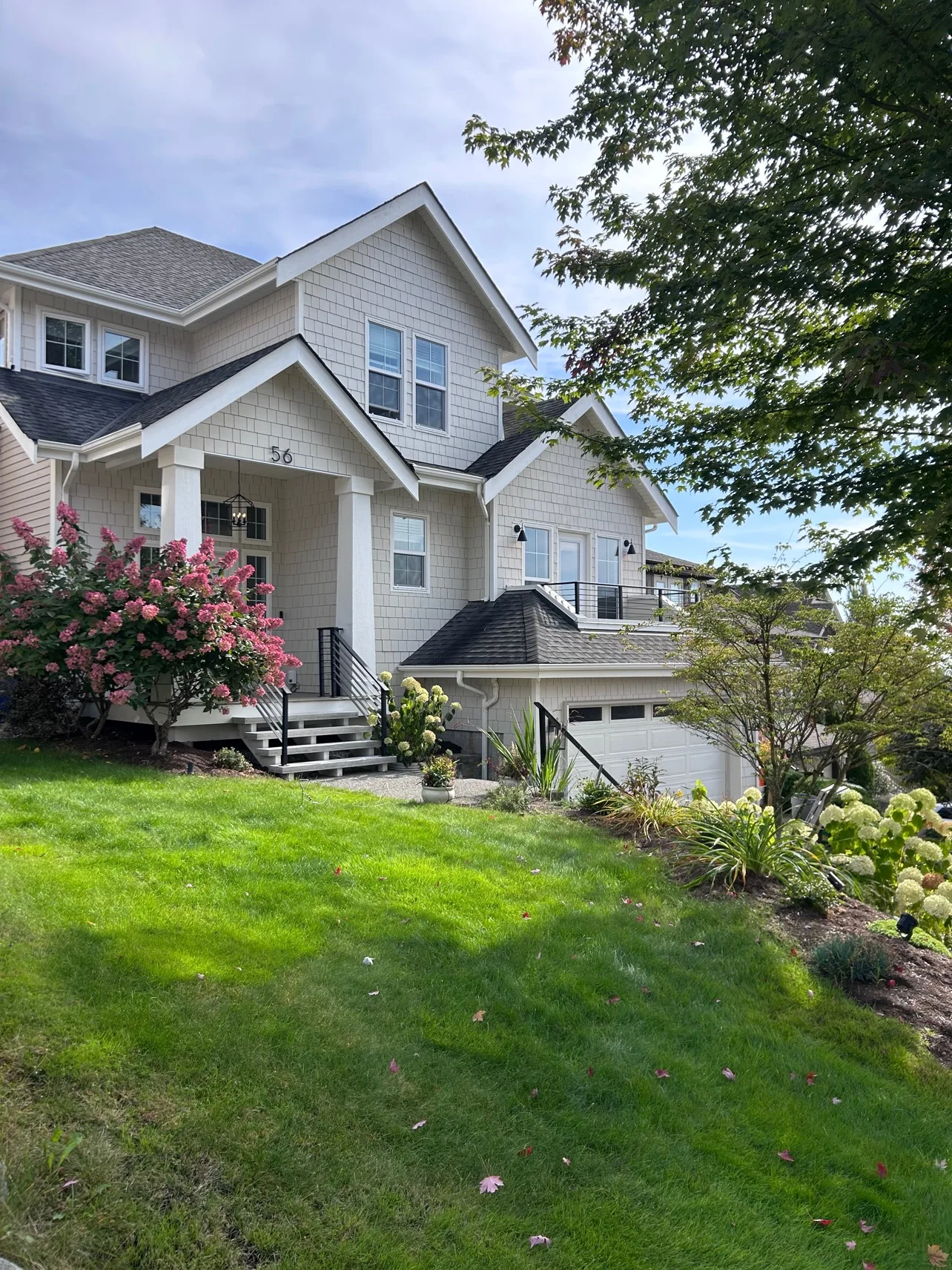 House exterior after re-side, from the lawn
