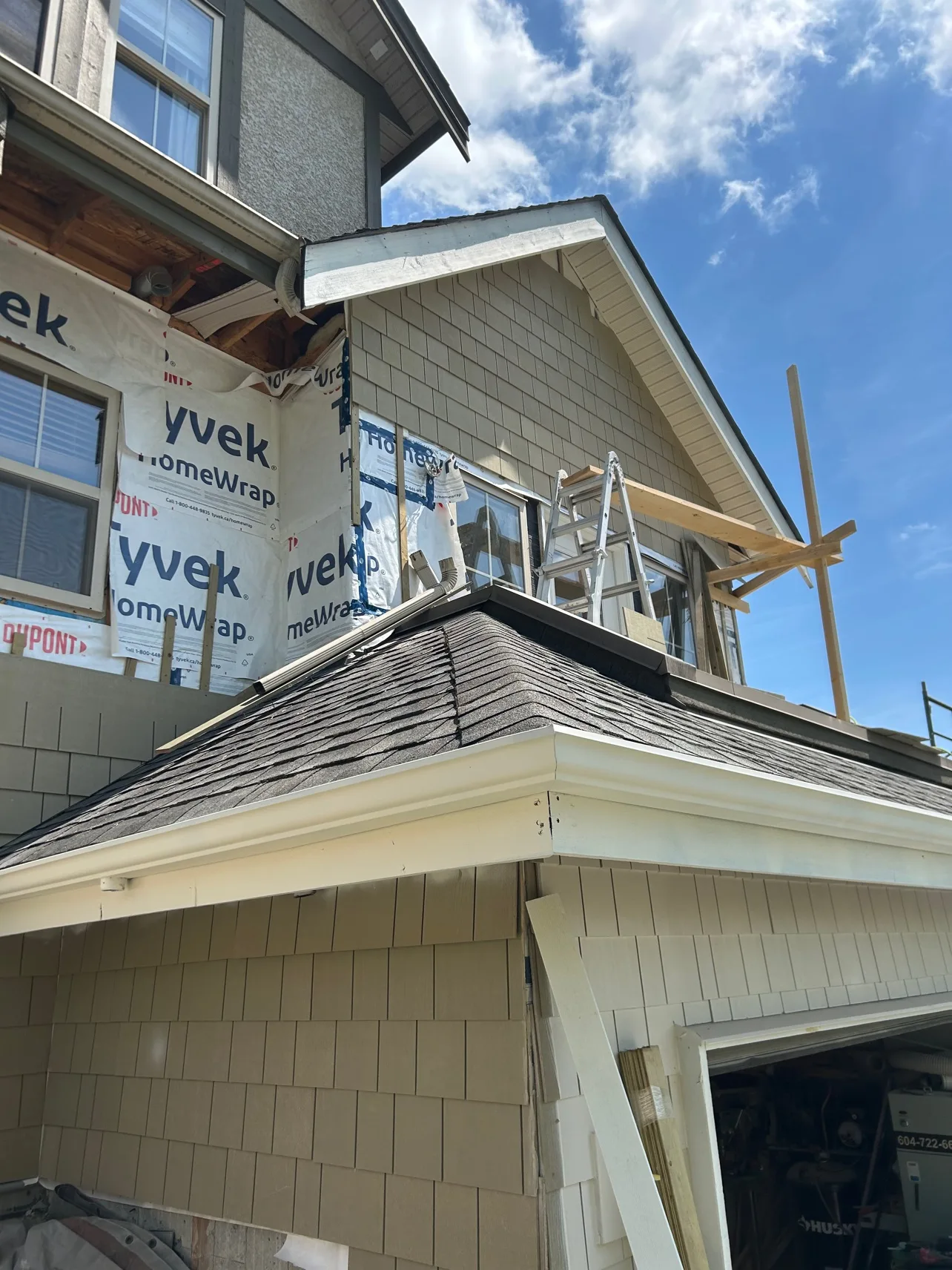 House during re-side, siding close-up above the garage
