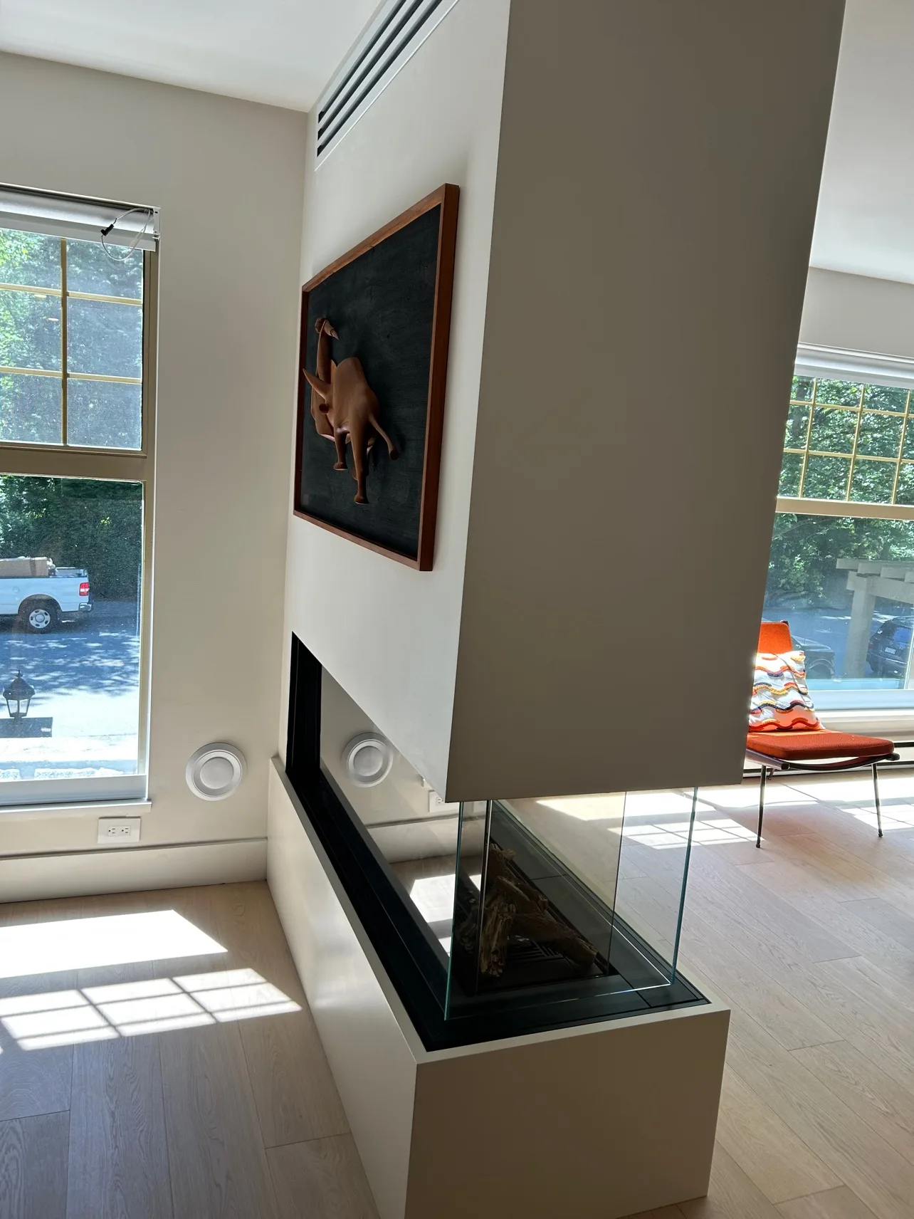 Reverse side of the fireplace wall with art