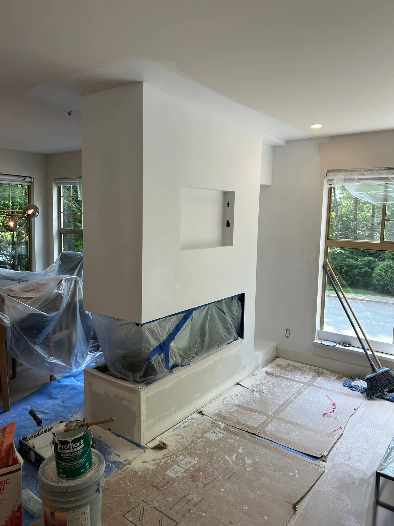 Feature wall built and painted, fireplace masked