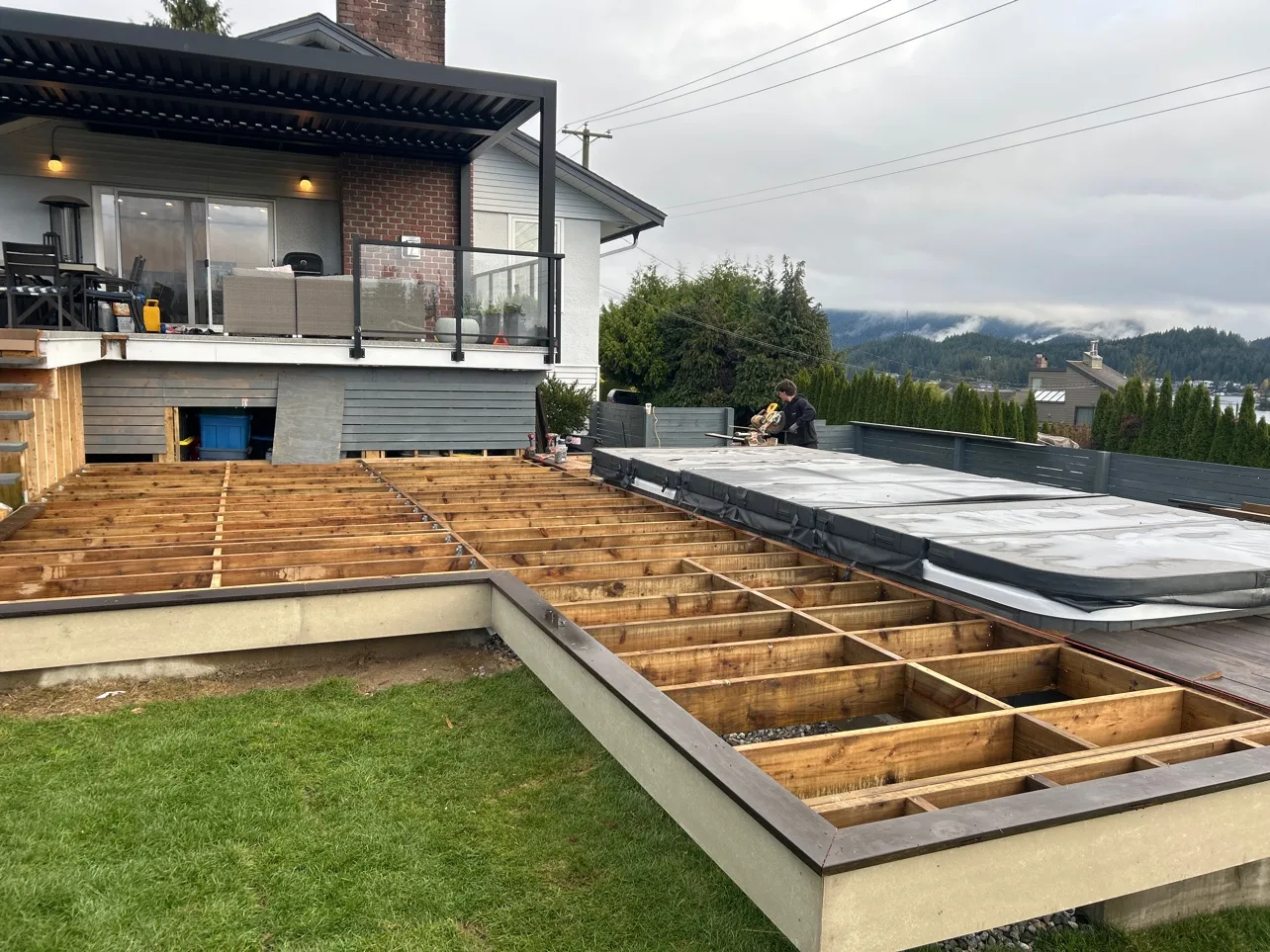 Deck under construction with a swim spa, framing complete, ready for decking