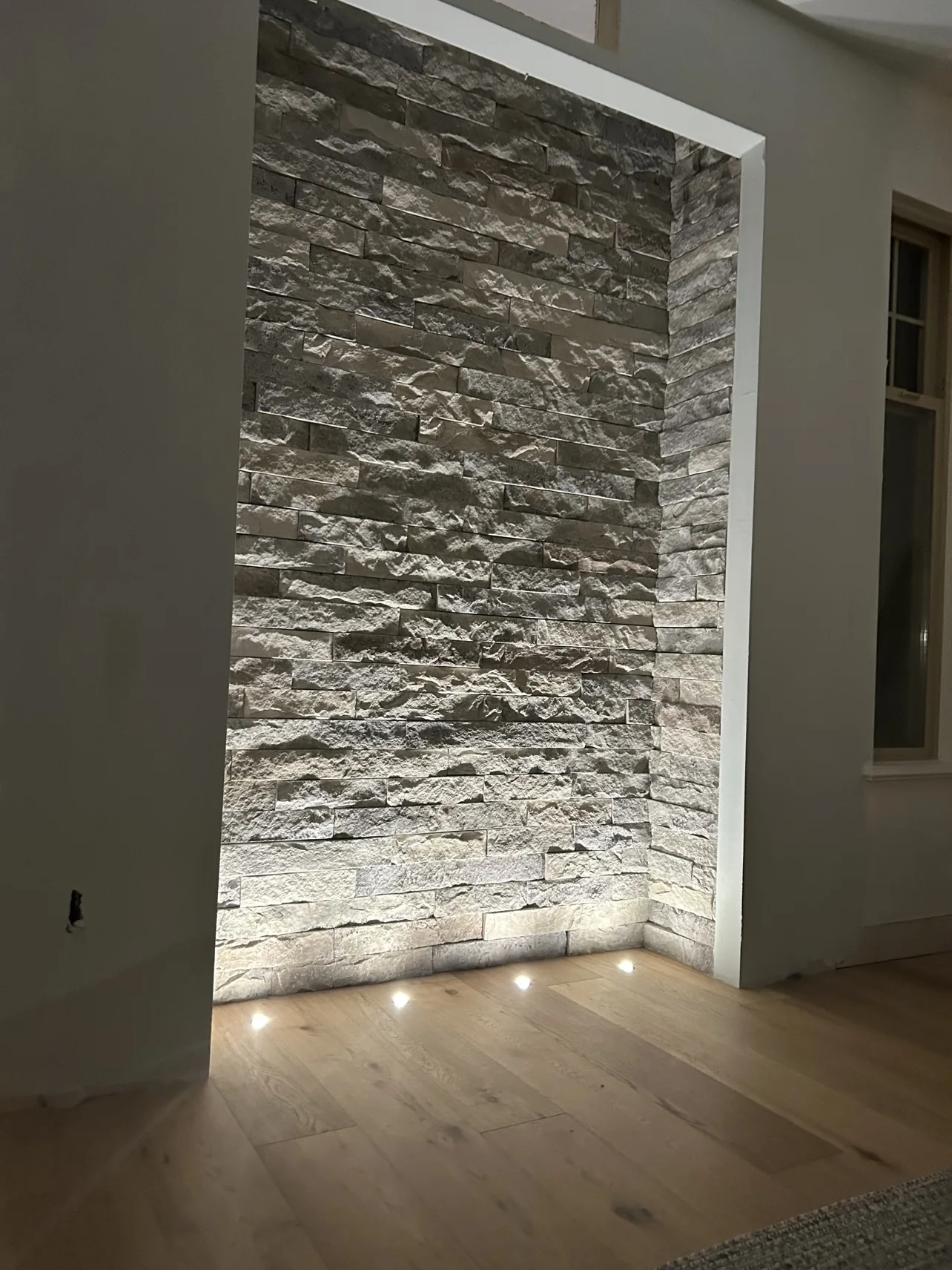 Stone feature wall finished and lit
